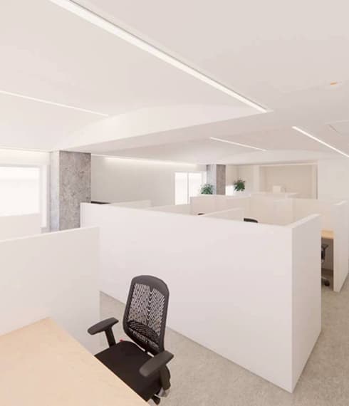 立った視点から見るオフィスの内観、白い壁で構成されたブース配置