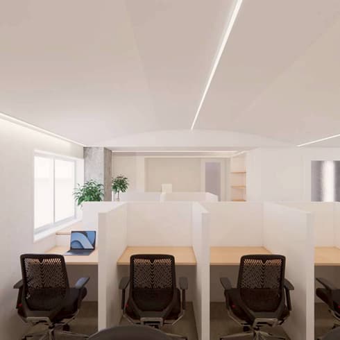 白を基調とした明るいオフィス空間に配置された、集中作業用のパーティション付きデスクエリア