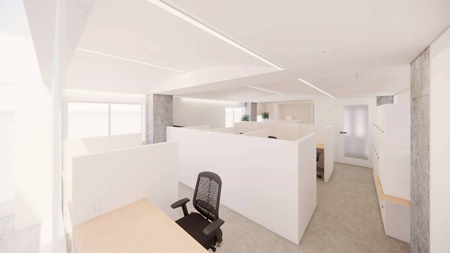 立った視点から見るオフィスの内観、白い壁で構成されたブース配置